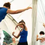 women performing somatic exercise