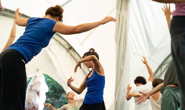 women performing somatic exercise