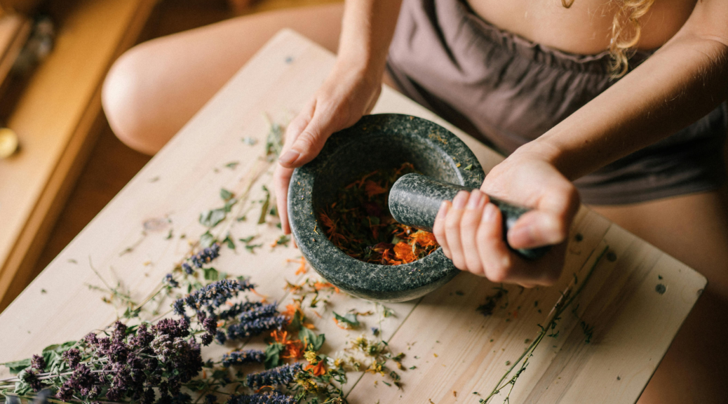 student making medicine during the wild herbalism course